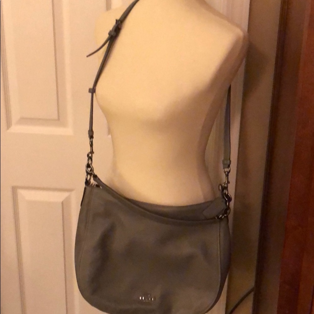 Gray leather Coach crossbody bag.